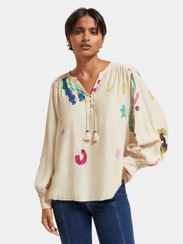 Lace-up blouse with balloon sleeves